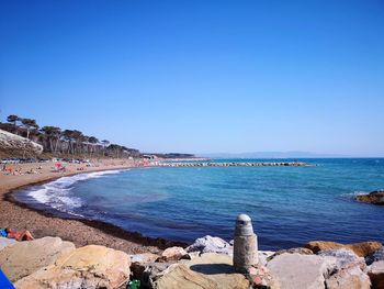 Scenic view of sea against clear blue sky