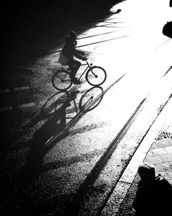 Shadow of people on road