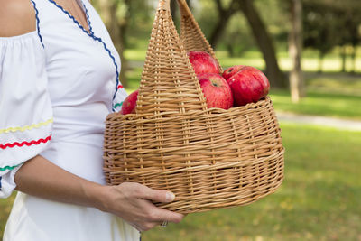 Midsection of man holding ice cream basket