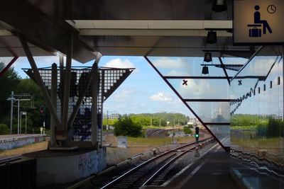 Train on railroad tracks against sky