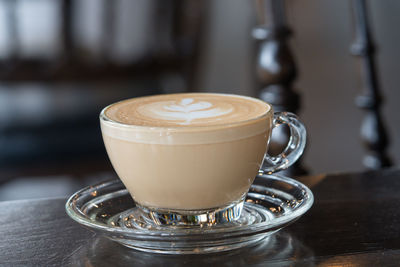 Close-up of coffee cup on table