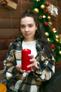 Portrait of young woman using mobile phone