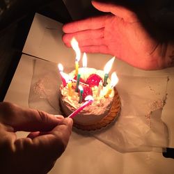 Cropped image of hand holding coffee