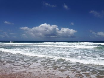 Scenic view of sea against cloudy sky