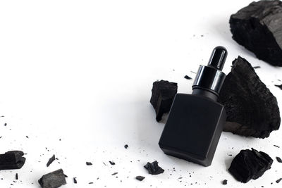 High angle view of rocks on table against white background