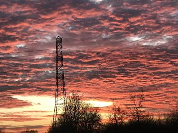 Low angle view of silhouette trees against sky during sunset