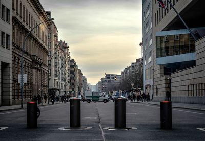 City street and buildings against sky