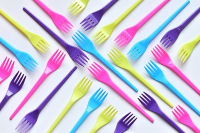 Directly above shot of colorful forks on table