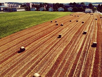 High angle view of hay bales on field