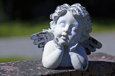 Close-up of angel statue in park