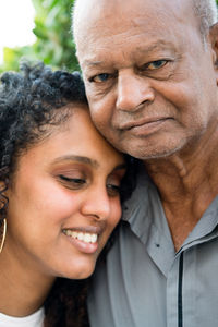 Portrait of a grandfather and granddaughter together