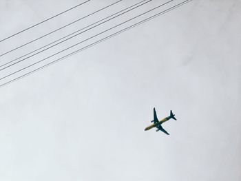 Low angle view of airplane flying in sky