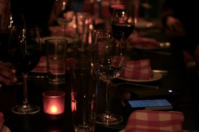 Close-up of wine glasses on table