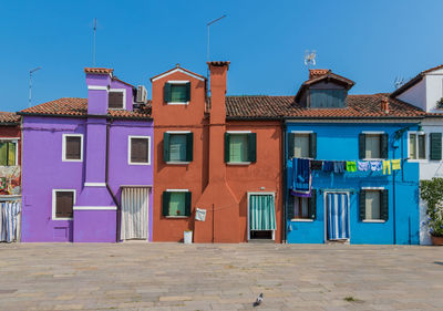 Residential buildings against blue sky