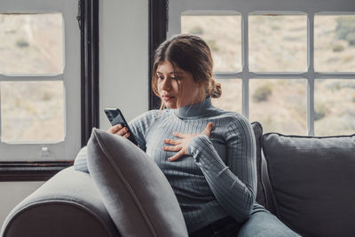Young woman using mobile phone
