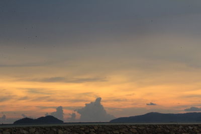 Scenic view of silhouette landscape against sky during sunset