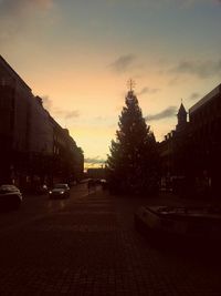 View of city street at sunset