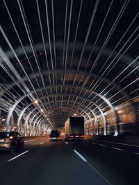 Road in illuminated tunnel