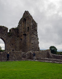 View of old ruin building against cloudy sky