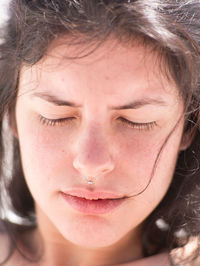 Close-up of woman wearing nose ring