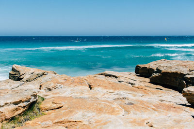 Scenic view of sea against clear blue sky