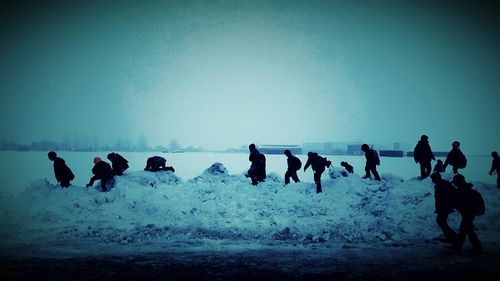People standing on snow
