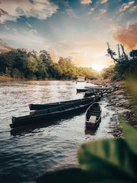 Scenic view of river against sky during sunset