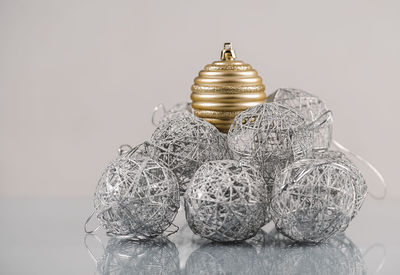 Close-up of gold colored pencils on table