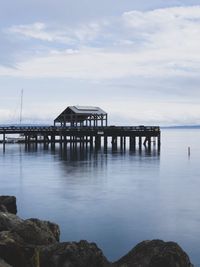 Pier over sea against sky