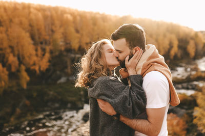 Young couple kissing outdoors