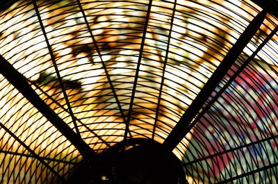 Full frame shot of glass ceiling against sky during sunset