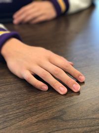 Close-up of hands on table