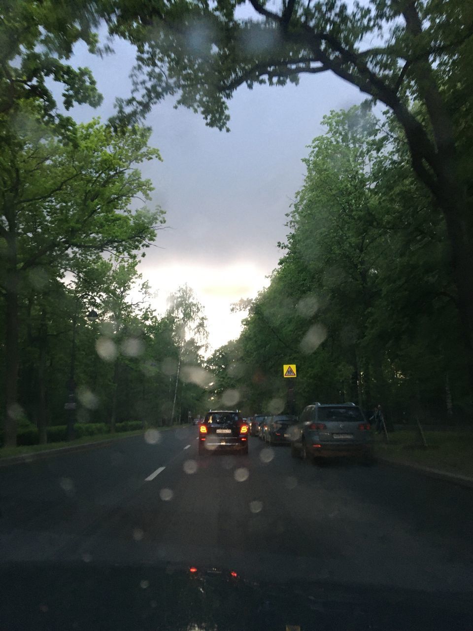 CARS ON ROAD IN RAIN