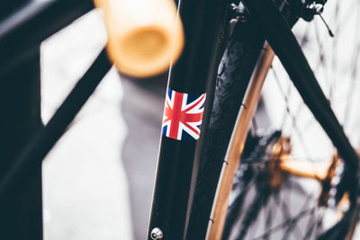 Close-up of bicycle with british flag