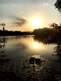 Scenic view of lake against sky during sunset