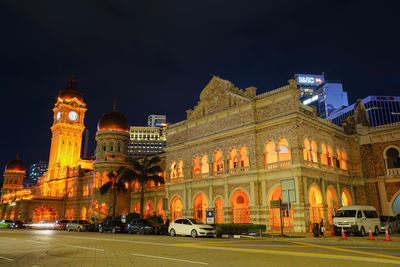 Illuminated buildings in city at night