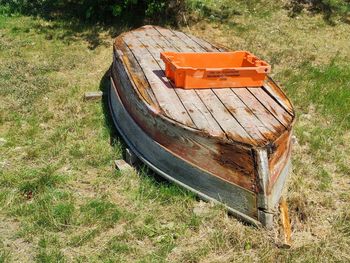 High angle view of abandoned seat on field