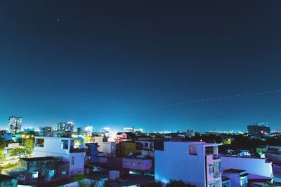 Buildings against clear blue sky