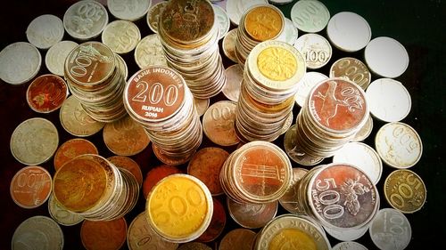 High angle view of coins on table