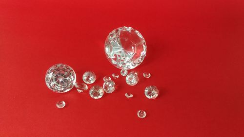 Close-up of bubbles over red background