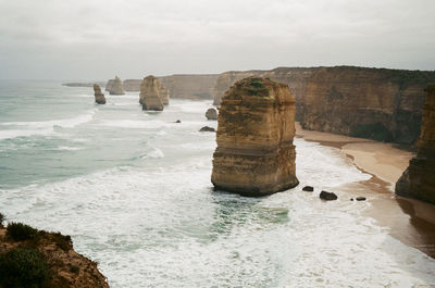 Rock formation on beach against sky, the twelve apostles in melbourne