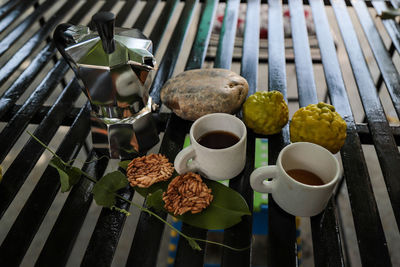 High angle view of coffee cups on table