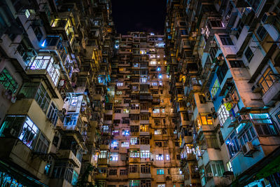 High angle view of illuminated buildings in city at night