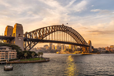 View of bridge over river against cloudy sky