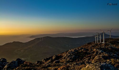 Scenic view of mountains against sky during sunset