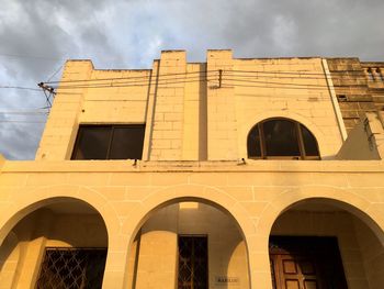 Low angle view of historic building against sky