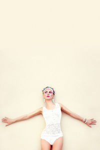 Fashion portrait of a sensual girl against the wall