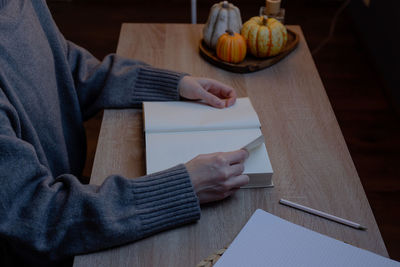 Midsection of man working at table