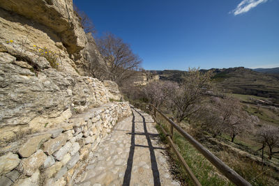 Scenic view of land against clear blue sky