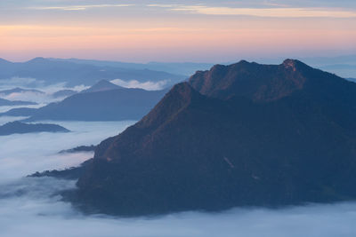 Scenic view of mountains against sky during sunset